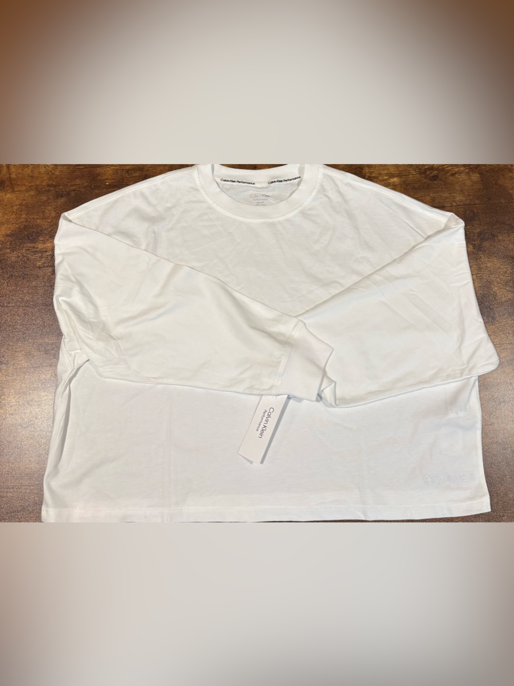 Size M Calvin Klein Performance White Long Sleeve Cropped Crewneck Tee